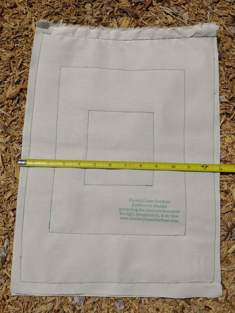 Earthworm Blanket and tape measure. sold by Dockery Lane Gardens
